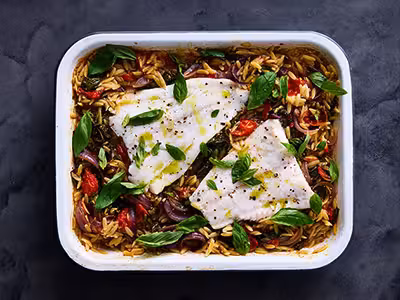 Baked Norwegian cod and cherry tomato orzo
