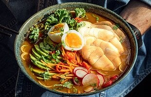 Norwegian cod with ramen, vegetables and egg