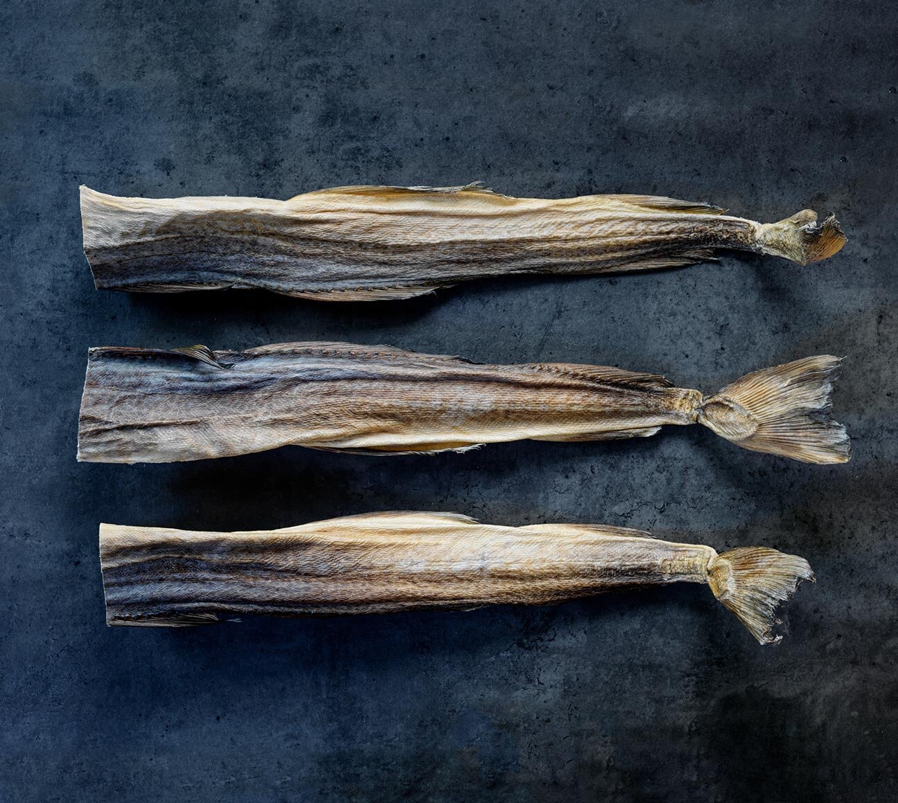 Whole Norwegian stockfish on dark background